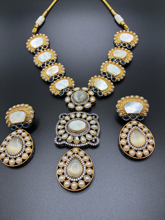 Sabyasachi inspired necklace with MoP mother of pearl, Monalisa stone pendant,small pearl with blue camphor stone hand work and earrings.